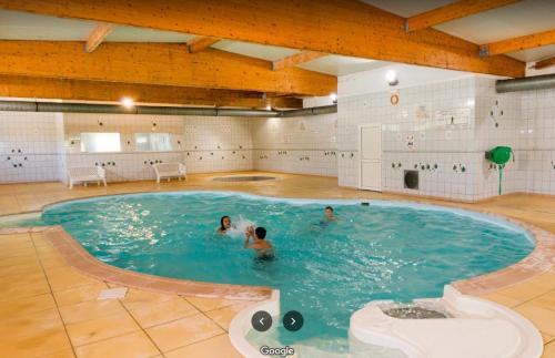 a group of people in a swimming pool at MobilHome Nicolette EUROPAPARK 20min in Boofzheim