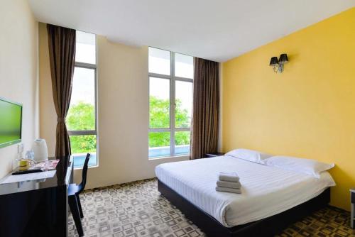 Katil atau katil-katil dalam bilik di Fumah Hotel Shah Alam