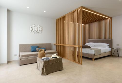 Ένα ή περισσότερα κρεβάτια σε δωμάτιο στο IL MARE DENTRO SUITES