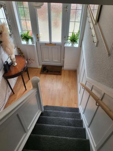 an overhead view of a staircase in a house at Petal Rm3 in Belle Isle