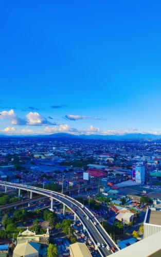 an aerial view of a city with a highway at SERENDIPITY PLACE @CELANDINE in Manila