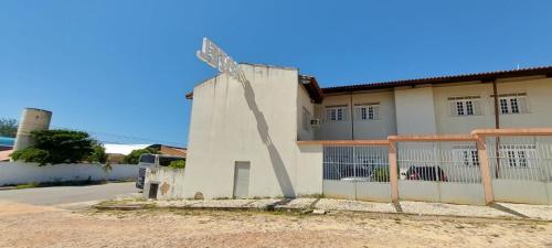 a building with a windmill on the side of it at Hotel Praia 2000 in Fortaleza