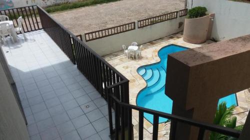 a view of a swimming pool from a balcony of a building at Hotel Praia 2000 in Fortaleza