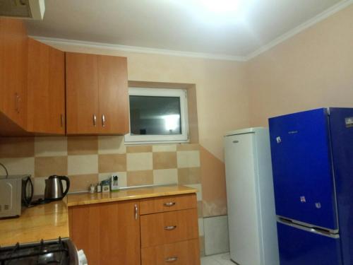 Η κουζίνα ή μικρή κουζίνα στο Сонячний Котедж