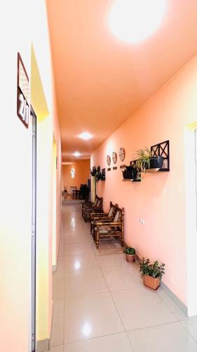 a hallway of a hospital with chairs and tables at MarNar Hotel in Yerevan
