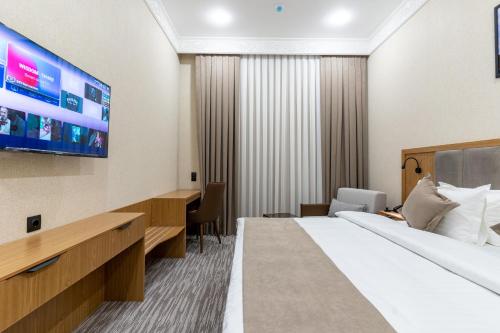 Katil atau katil-katil dalam bilik di MIRZO HOTEL