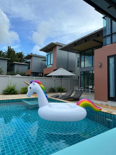 a inflatable unicorn float in a swimming pool at Aonang nine poolvilla in Ao Nang Beach