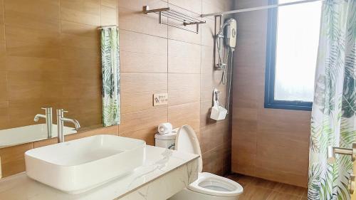 a bathroom with a sink and a toilet at Aonang nine poolvilla in Ao Nang Beach