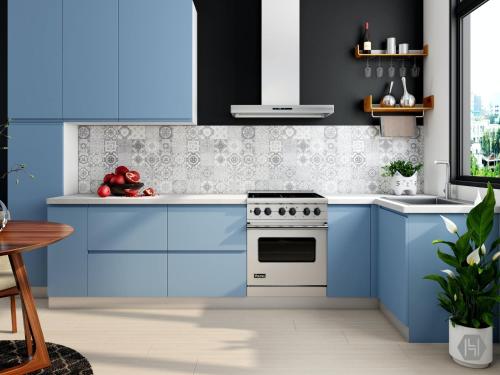 a kitchen with blue cabinets and a stove at Doña Maria, apartamento completo in Leganés