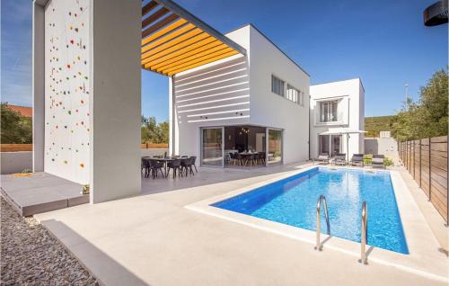 an image of a house with a swimming pool at Villa Activia in Sveti Filip i Jakov