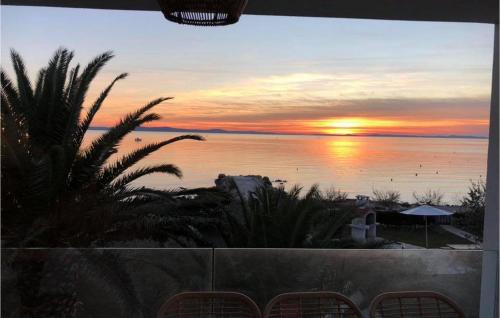 a view of a sunset from the balcony of a resort at Villa Sunset Loft in Vir