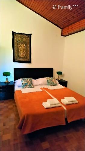 a bedroom with two beds with towels on them at Family*** in Selce