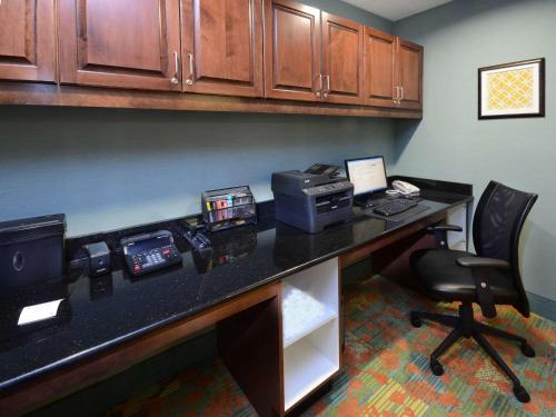 an office with a desk with a printer and a chair at Hampton Inn Martinsville in Martinsville