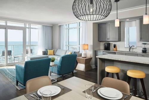 a living room with a kitchen and a living room at Hilton Grand Vacations Club Ocean Enclave Myrtle Beach in Myrtle Beach