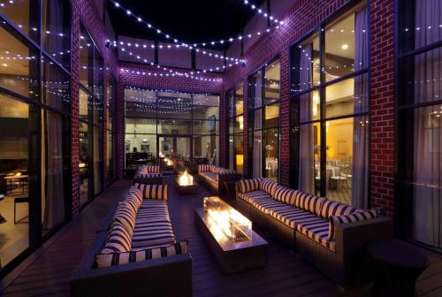 a building with couches and lights on a building at Hilton Mystic in Mystic