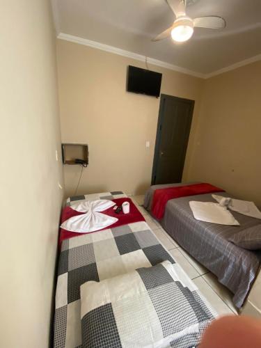Кровать или кровати в номере HOTEL CRISTAL