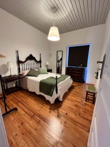 Кровать или кровати в номере Casa das Memórias
