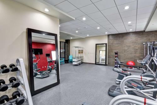 a gym with treadmills and machines in a room at Home2 Suites by Hilton OKC Midwest City Tinker AFB in Midwest City