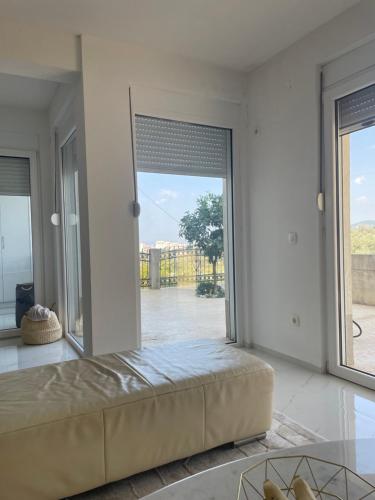 a large room with a large window with a bed at Apartment Ajdarpasic in Bar