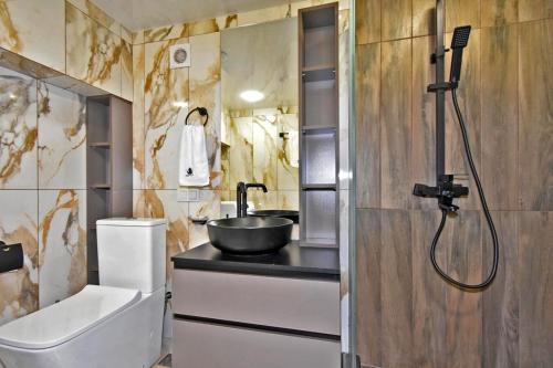 a small bathroom with a sink and a shower at Yellow forest 11 in Yerevan