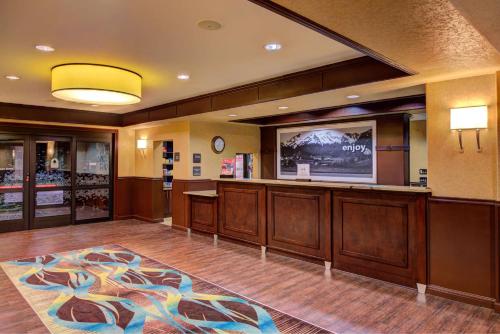 a large room with a hair salon with a tv at Hampton Inn & Suites Ontario in Ontario