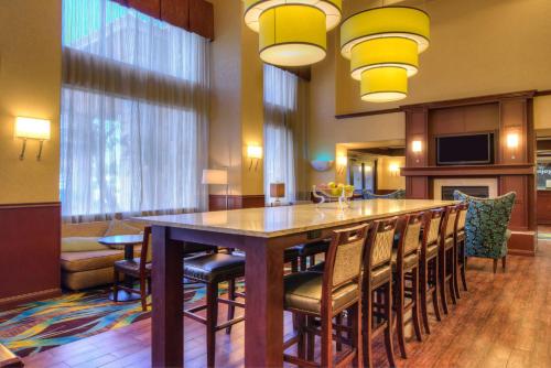 a large dining room with a large table and chairs at Hampton Inn & Suites Ontario in Ontario