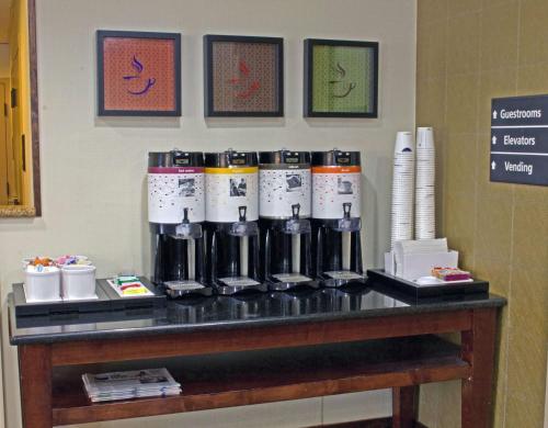 a counter with a group of bottles on a table at Hampton Inn Norfolk/Chesapeake - Greenbrier Area in Chesapeake