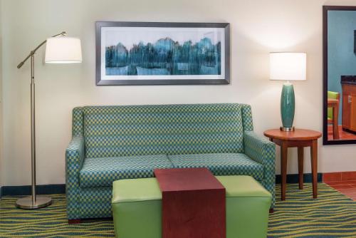 a living room with a couch and a table at Homewood Suites by Hilton Virginia Beach in Virginia Beach