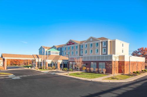 an empty street in front of a large building at Hilton Garden Inn Devens Common in Devens