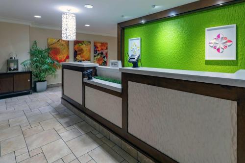 a lobby of a hospital with a green wall at Hilton Garden Inn Devens Common in Devens