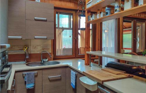 a kitchen with a sink and a counter top at 2 Bedroom Amazing Home In Wilcze in Wilcze
