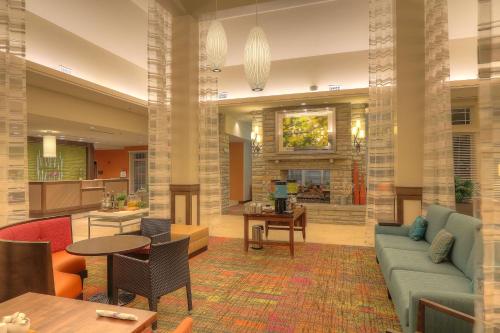 a lobby with a couch and a table at Hilton Garden Inn Pigeon Forge in Pigeon Forge