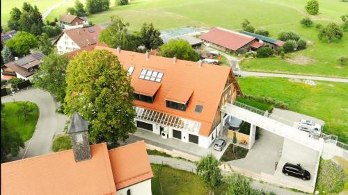 an overhead view of a house with an orange roof at Trautesheim Ferienwohnungen in Wangen im Allgäu