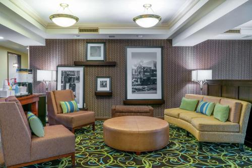 a waiting room with chairs and a table at Hampton Inn & Suites Valley Forge/Oaks in Phoenixville