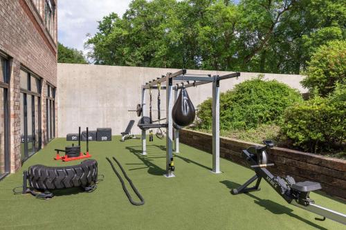 a gym with a tire swing and weights at Embassy Suites by Hilton Philadelphia Valley Forge in Wayne