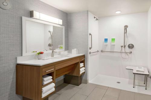 a bathroom with a sink and a shower at Home2 Suites By Hilton Scottsdale Salt River in Scottsdale