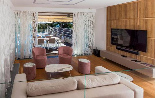 a living room with a couch and a glass table at Villa Calla in Petrcane
