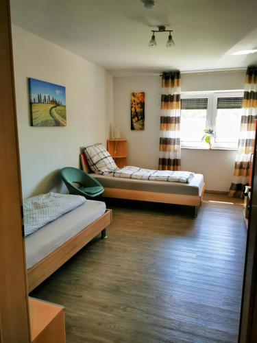 a room with two beds in a room at Wohnung 13 in Wildeshausen