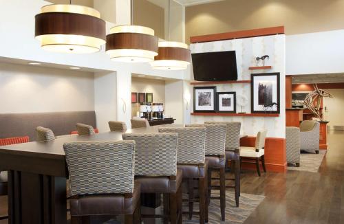 a large dining room with a long table and chairs at Hampton Inn & Suites Pittsburgh-Meadow Lands in Washington