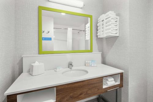 a bathroom with a sink and a mirror at Hampton Inn Odessa Trinity in Odessa