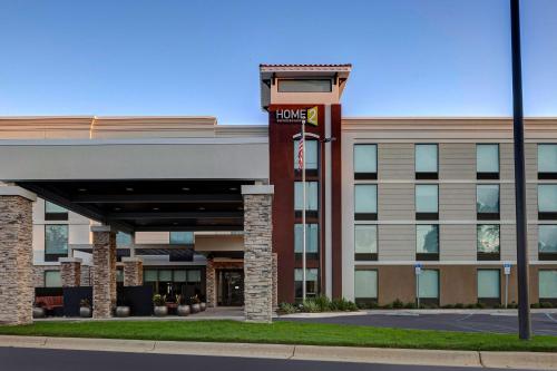 a hotel building with a sign in front of it at Home2 Suites by Hilton Gulf Breeze Pensacola Area, FL in Gulf Breeze