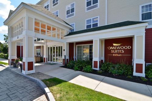a building with a sign in the window of a store at Homewood Suites by Hilton Dover in Dover