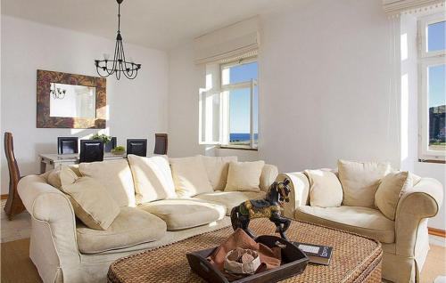 a living room with two white couches and a table at Villa Mar in Lumbarda