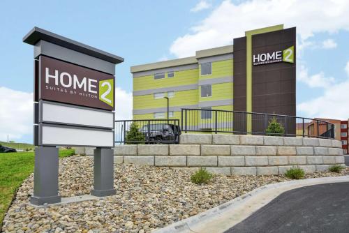 a home sign in front of a building at Home2 Suites By Hilton Rapid City in Rapid City