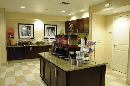 a kitchen with a counter with a coffee maker on it at Hampton Inn & Suites Redding in Redding