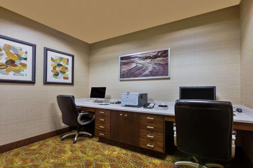 an office with a desk with two chairs and a computer at Hampton Inn & Suites Bend in Bend