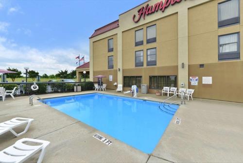 a swimming pool in front of a hotel at Hampton Inn Raleigh Clayton I-40 Garner in Garner