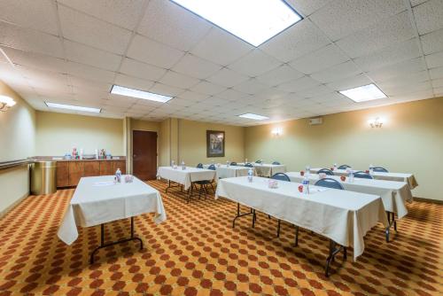 a conference room with white tables and chairs in it at Hampton Inn Raleigh Clayton I-40 Garner in Garner
