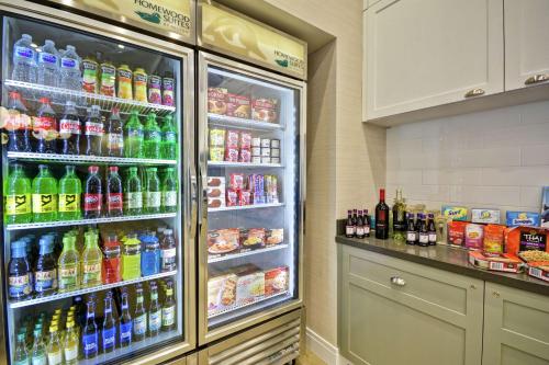 a refrigerator filled with lots of different types of drinks at Homewood Suites by Hilton Raleigh Cary I-40 in Cary