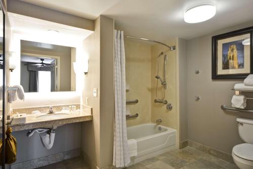 a bathroom with a tub and a sink and a toilet at Homewood Suites Durham-Chapel Hill I-40 in Durham